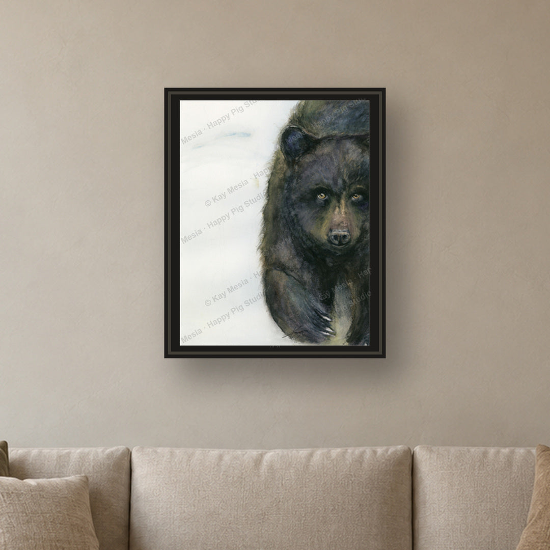 Black Bear fine-art print shown in a styled room for display inspiration. Print is sold unframed.