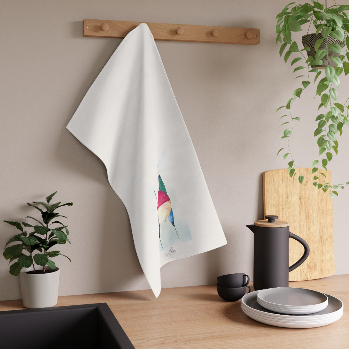 Four Bobbers tea towel displayed in a kitchen; original artwork by Kay Mesia